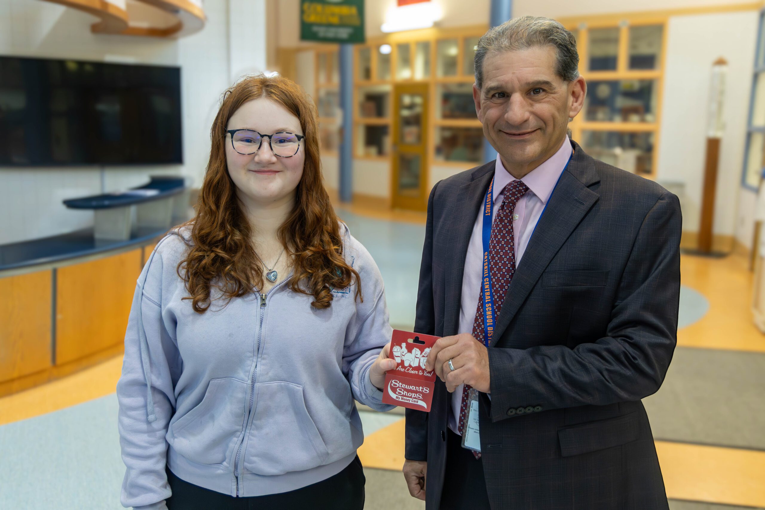 girl shaking principal's hand