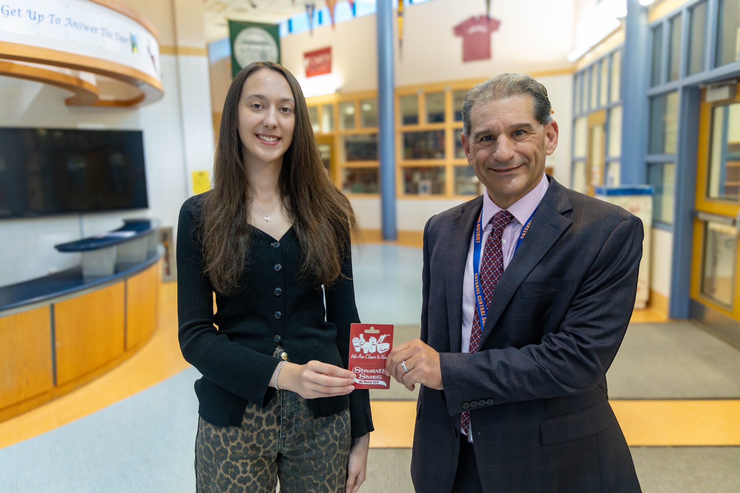 girl shaking principal's hand
