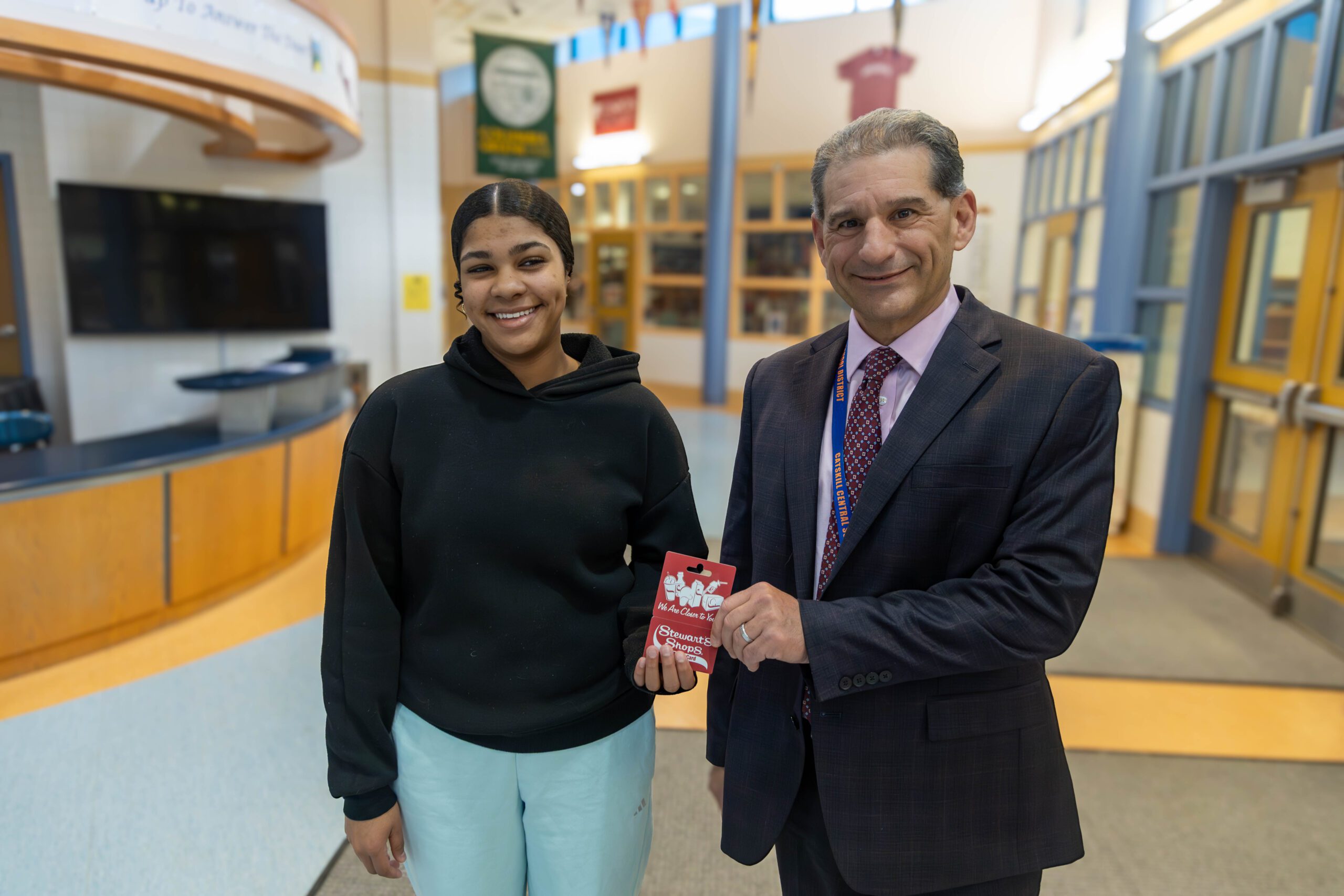girl shaking principal's hand