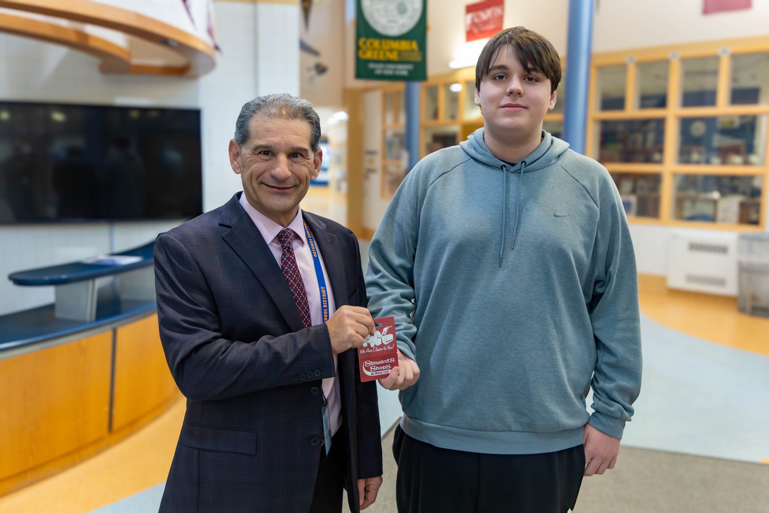 boy shaking principal's hand