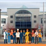 Catskill Elementary School with cartoon people superimposed in front of it.
