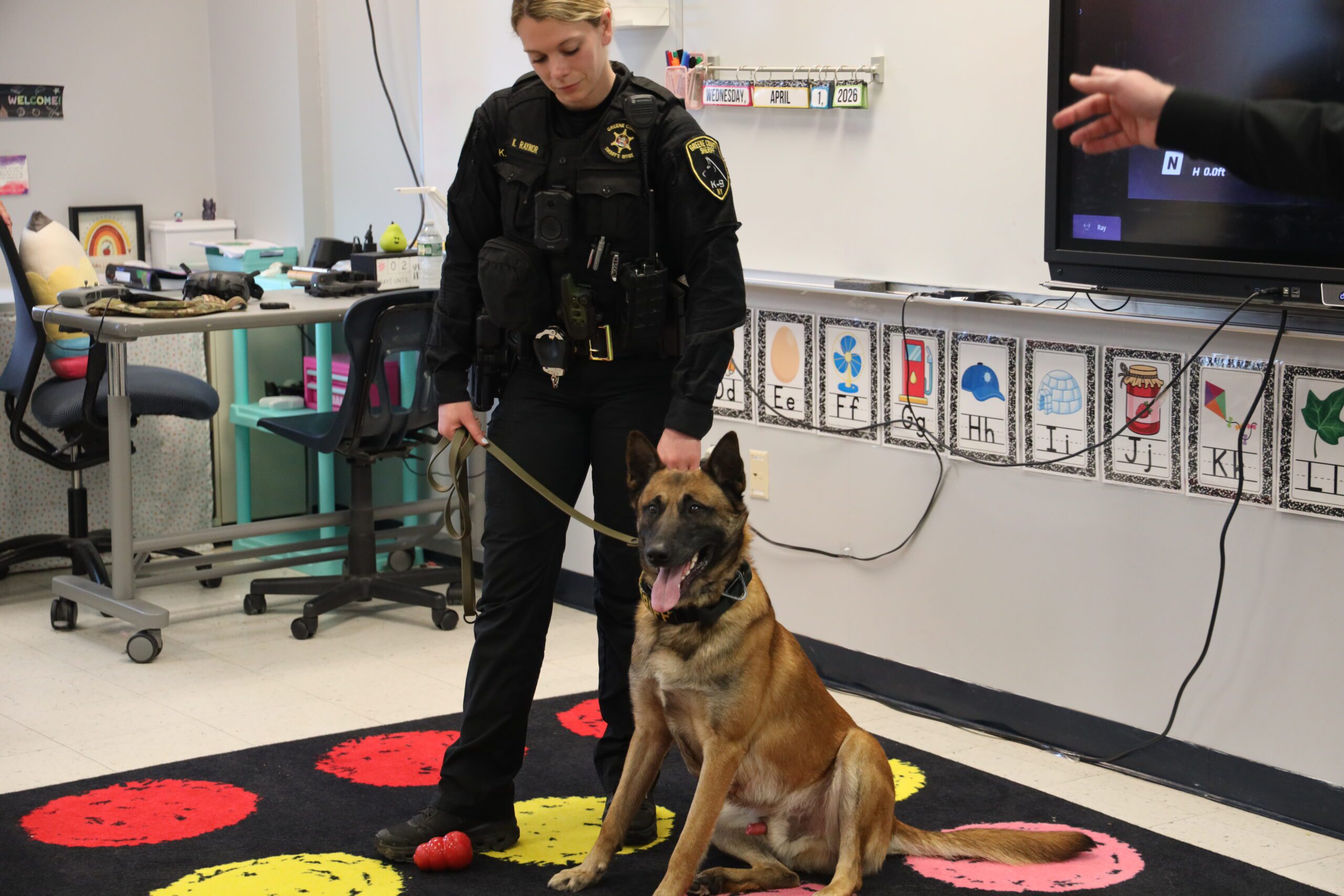 police woman and police dog in classroom