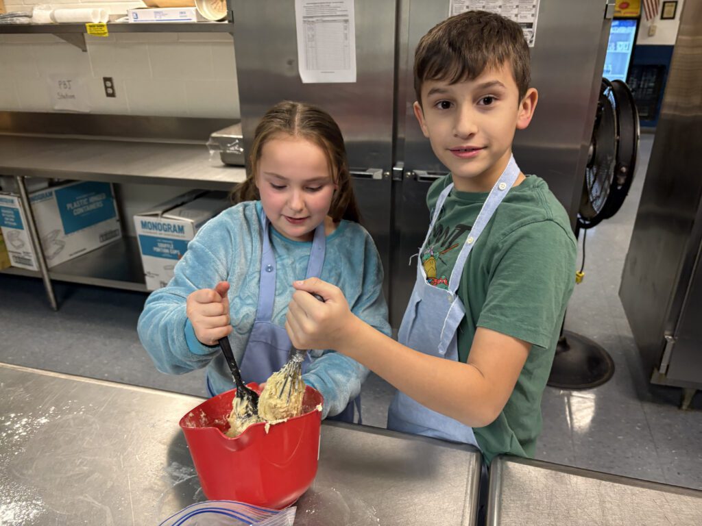 boy and girl mixing dough