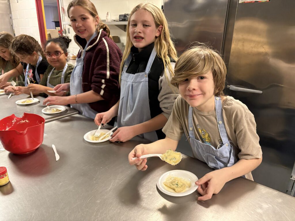 students eating pasta