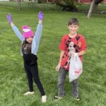 boy and girl picking up trash