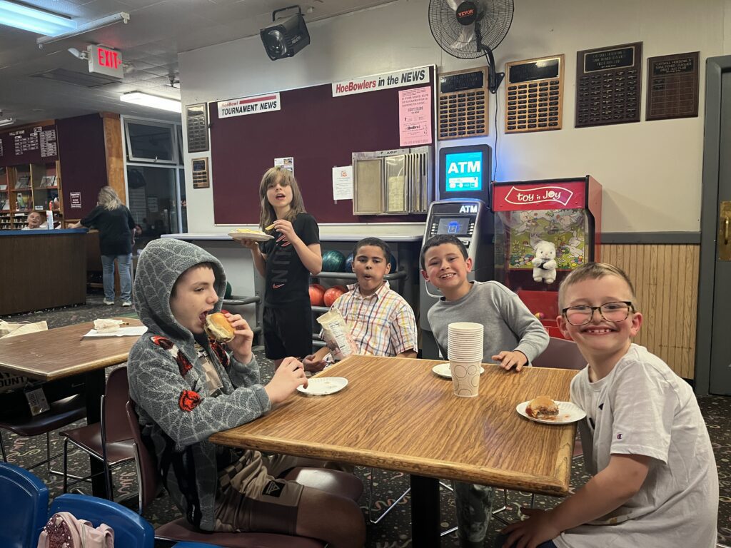 students eating snacks at table