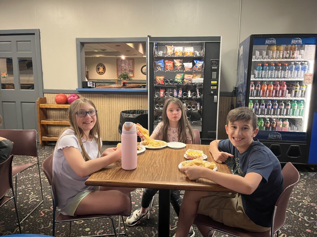 students eating snacks at table