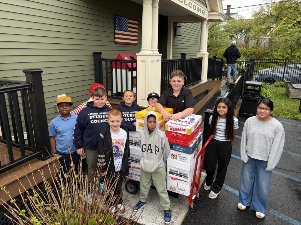 group of students delivering boxes to Ronal McDonald House
