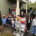 group of students delivering boxes to Ronal McDonald House