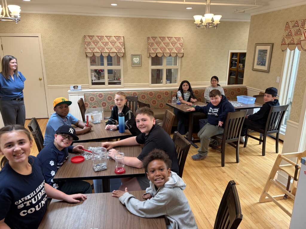 students seated at tables at Ronald McDonald House