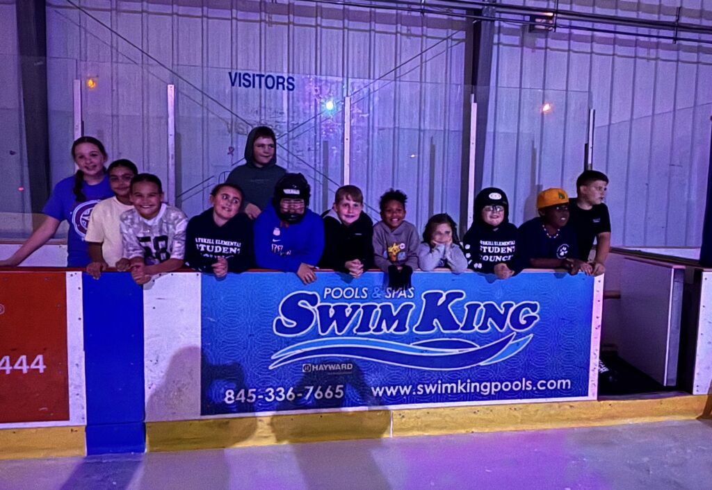 groups photo of CES Student Coucil on hockey bench