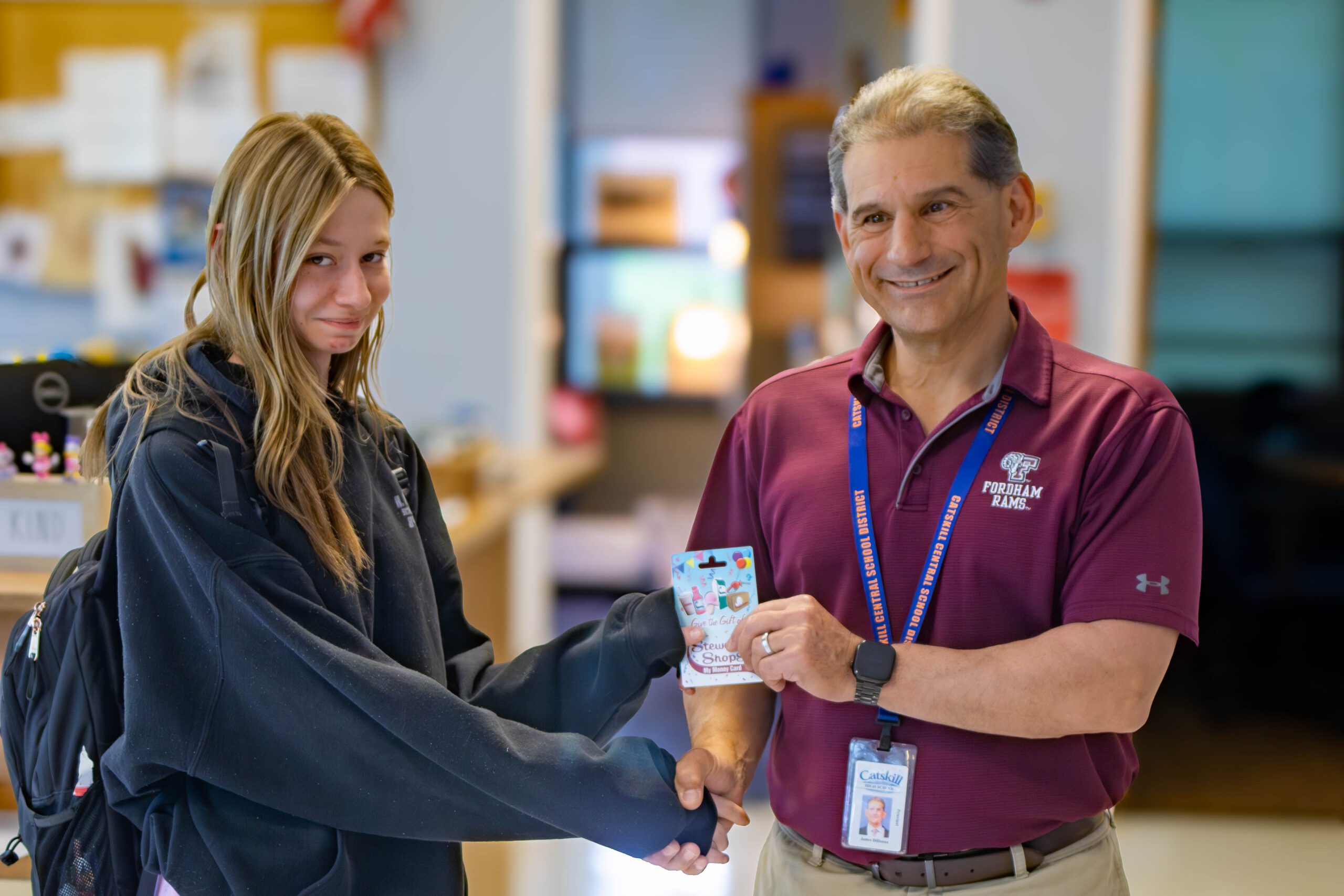 girl accepting award from principal 