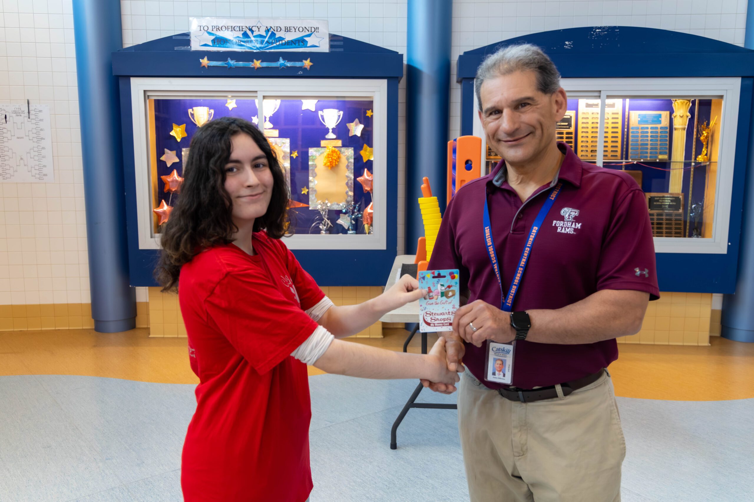 girl accepting award from principal 