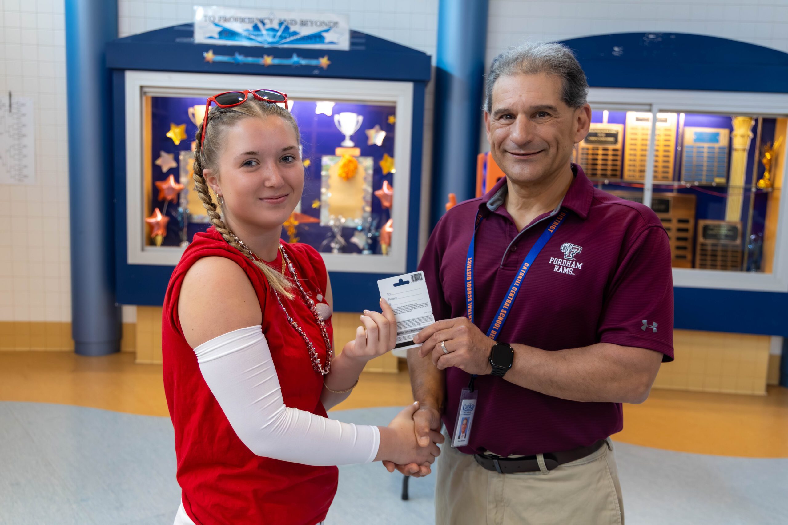 girl accepting award from principal 