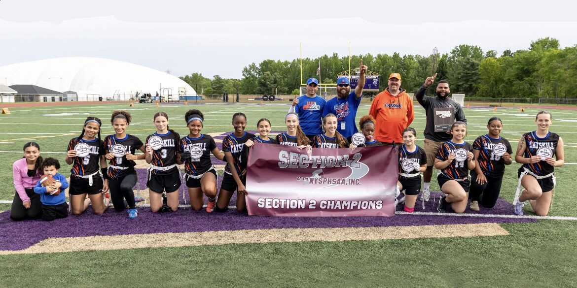 Catskill flag football team with Section 2 champion banner