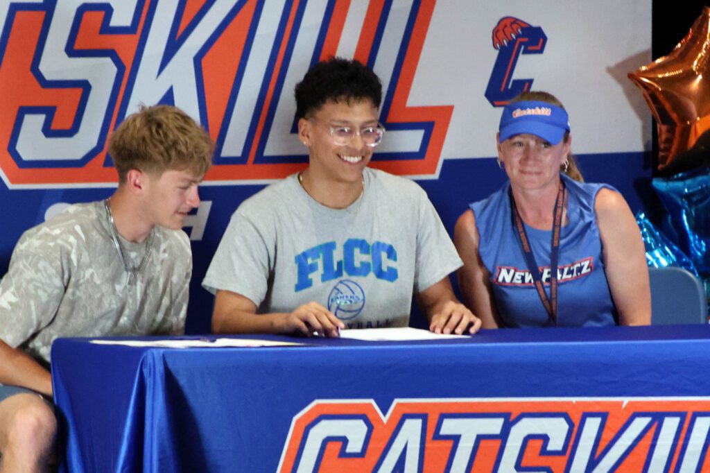 young man signing letter of intent
