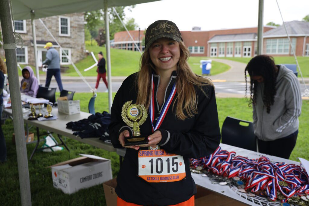 woman holding trophy