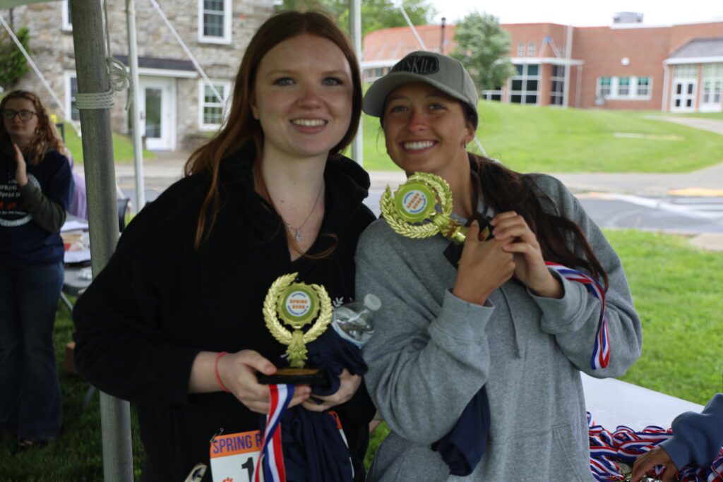 two young women wearing medals
