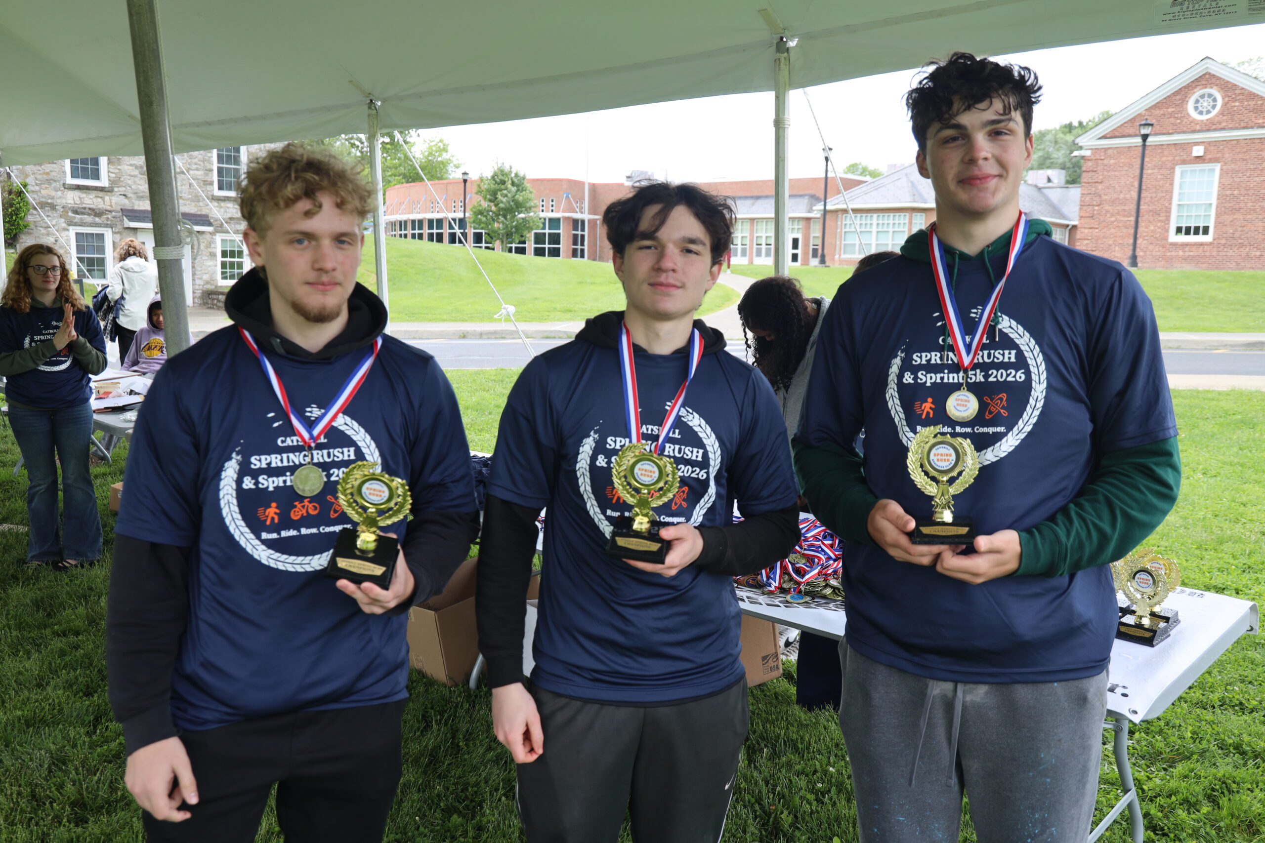 three young men wearing medals