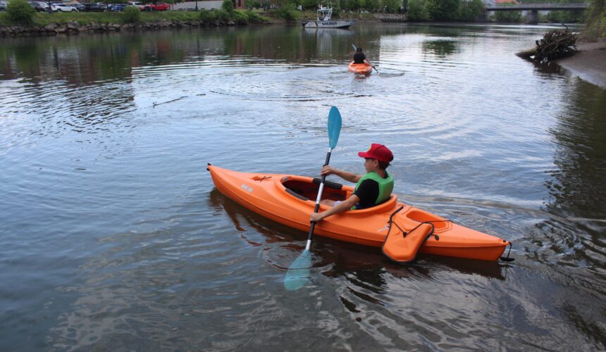 kf2 boy in kayak on creek